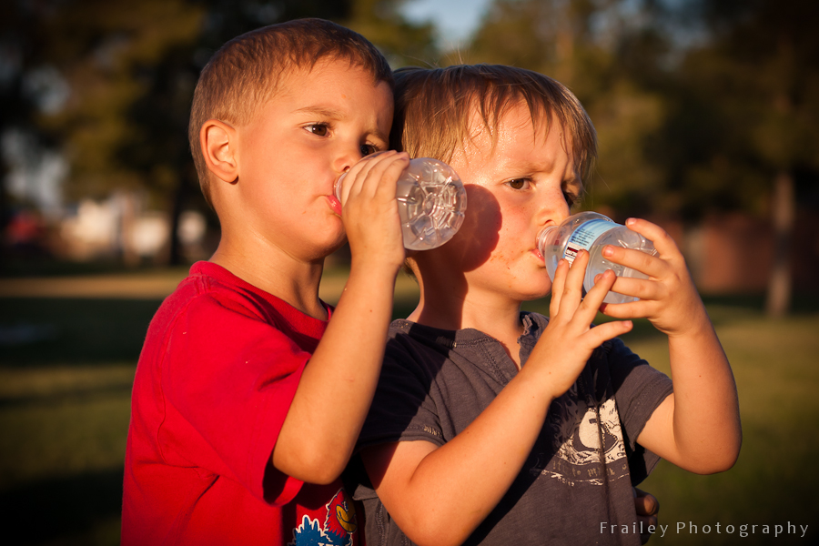 Two little boys taking a water break.