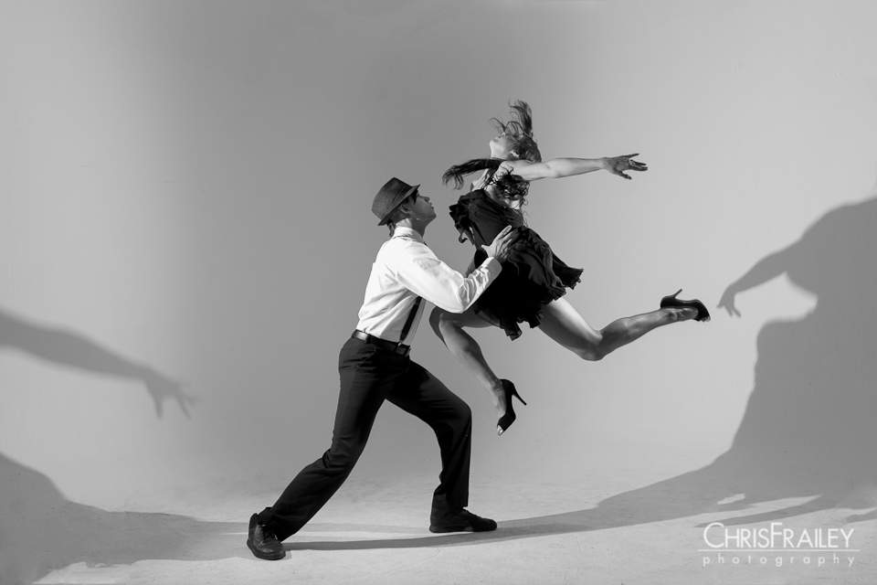 Female dancer jumping to her partner