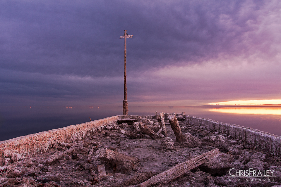 An old pier at the Salton Sea at sunset.