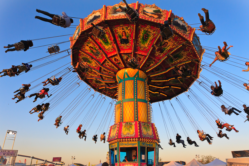 A carnival swing ride takes its customers for a spin.