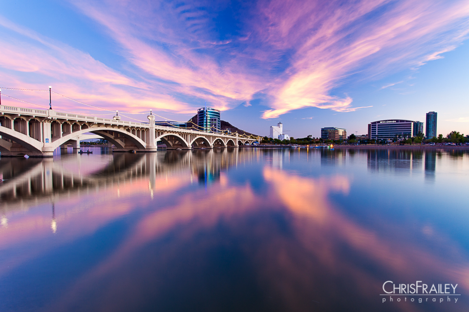 A sunset explodes across Tempe Town Lake. 