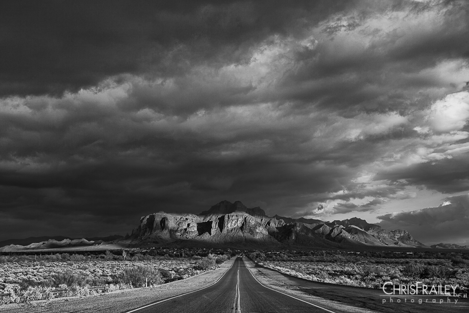 A dark and stormy sky surrounds the Superstition Mountains.