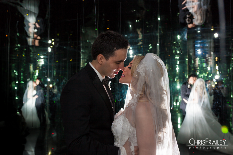 Phoenix Wedding - Karen and Ivan enjoy a kiss inside the Firefly room at the Phoenix Art Museum