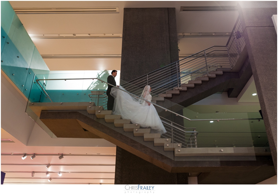 Phoenix wedding bride and groom walking down stairs at Phoenix Art  Museum