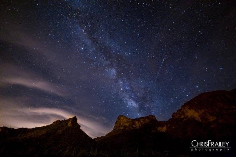 A Perseids meteor is captured next to the Milky Way over the Arizona desert.