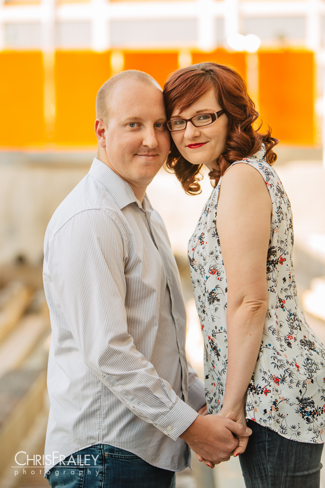 A young couple posing for their Mesa Arts Center engagement session.