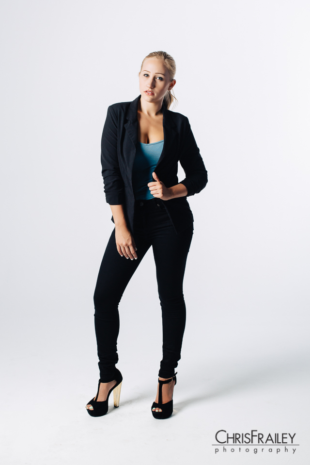 Model posing wearing a pant suit for an editorial shoot. 