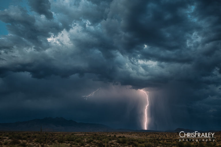 A lightning strike occurs out in the Arizona desert during the Monsoon.