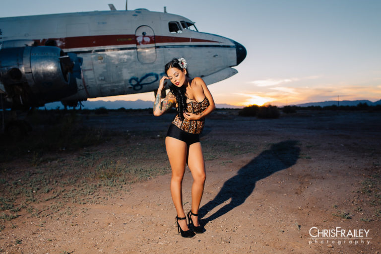 An abandoned airport serves as a perfect backdrop for a pinup photo shoot.