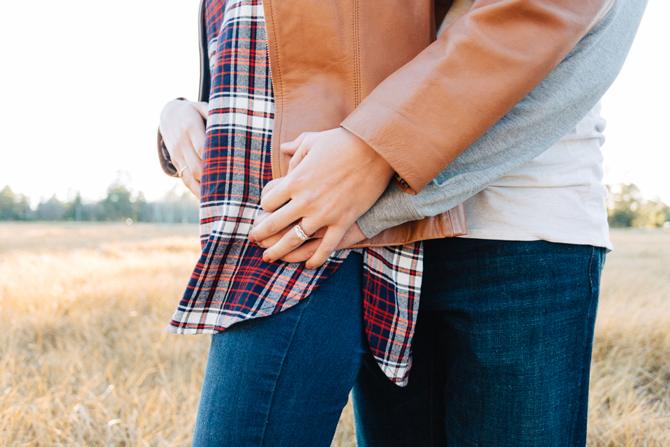 Close up of a couple holding hands during their Payson engagement session.