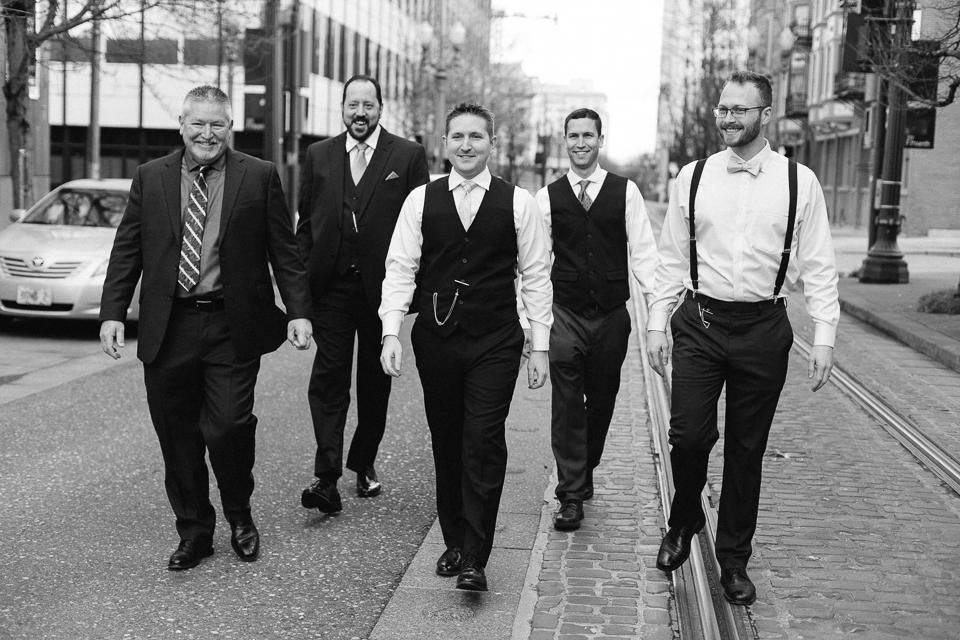 Groomsmen walking down street for a Portland wedding.