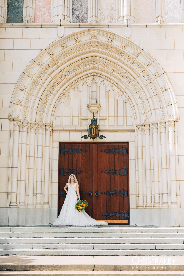 Bride posing with bouquet in front of a church in Fort Worth Texas.