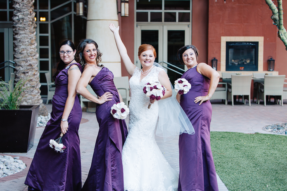 Bride posing with her bridesmaids.