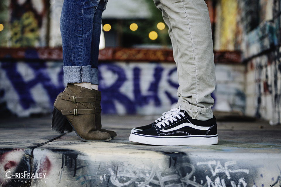 Close up of couple's shoes as they are on tippy toes during their engagement shoot at Roosevelt Row. 