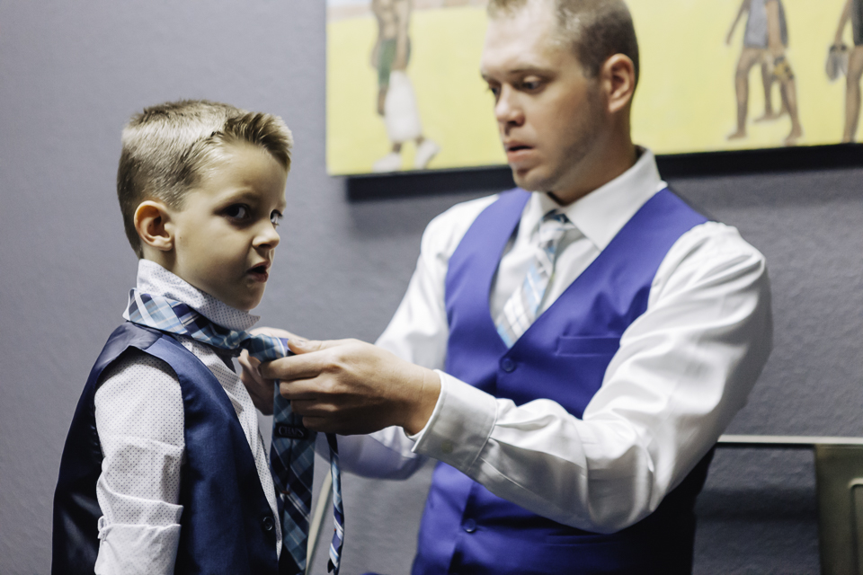 Ring bearer getting his tie on. 