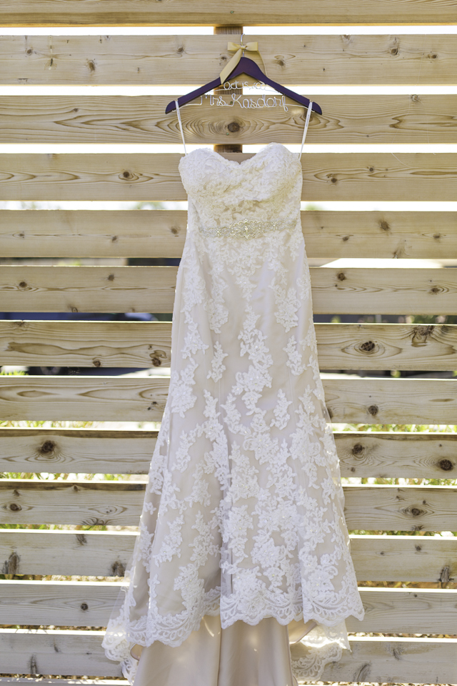 Wedding dress hanging up. 
