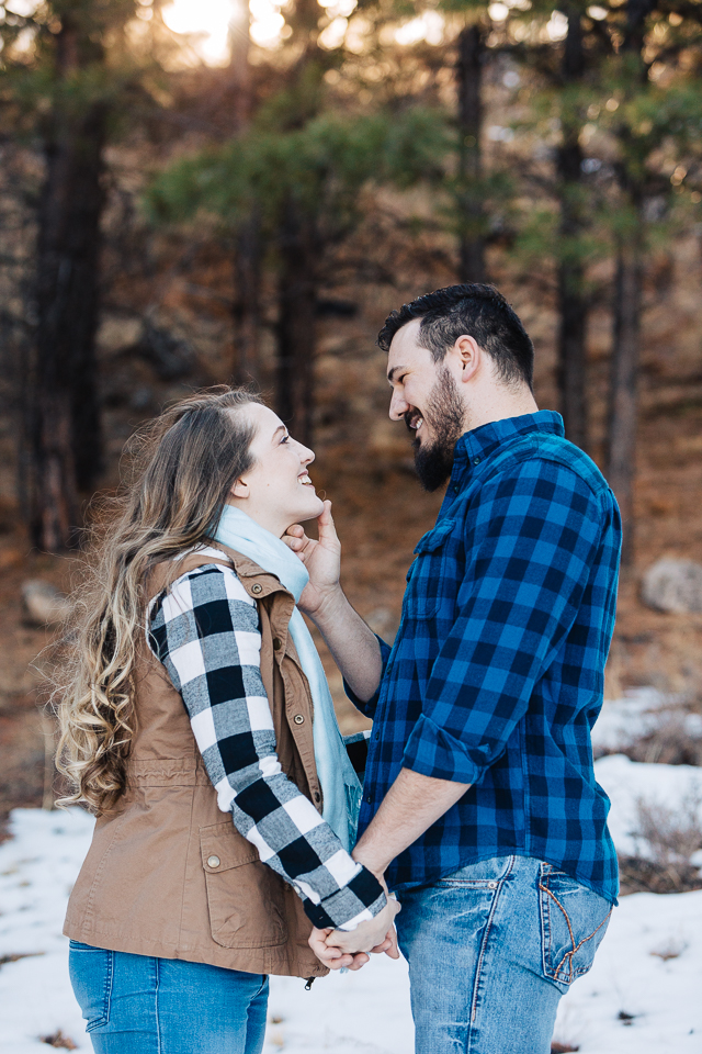 Couple holding hands at their engagement session in Payson. 