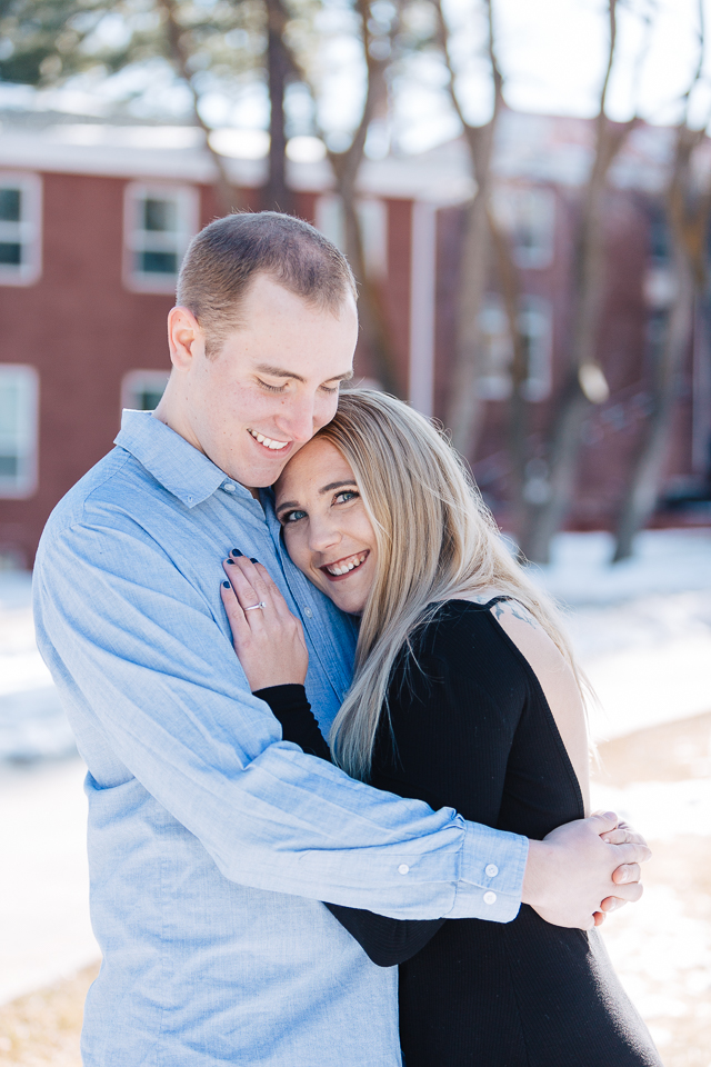 Engaged couple snuggling with each other during their Flagstaff engagement session. 