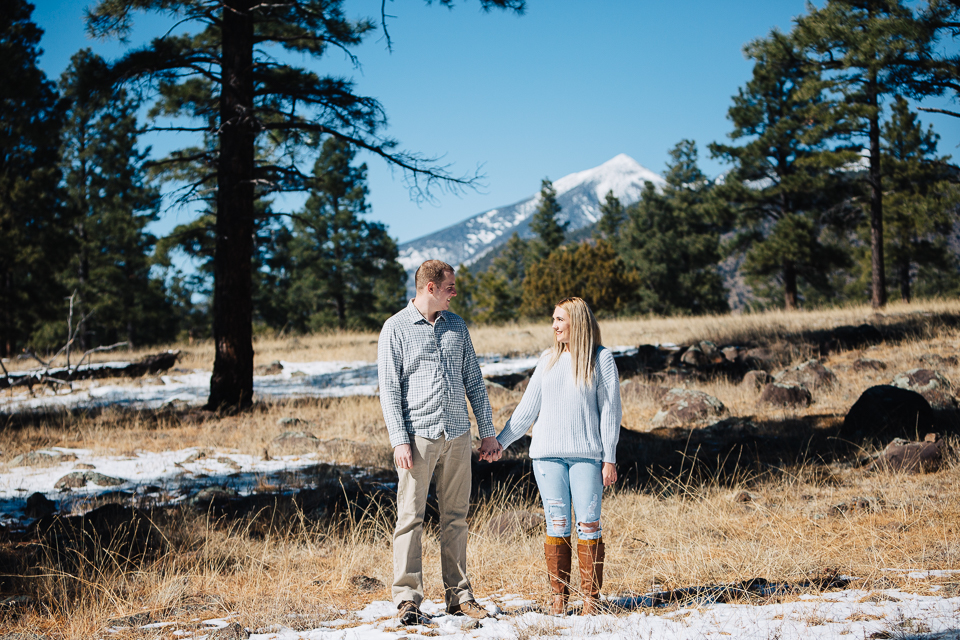 A young couple posing for their Flagstaff engagement session. 