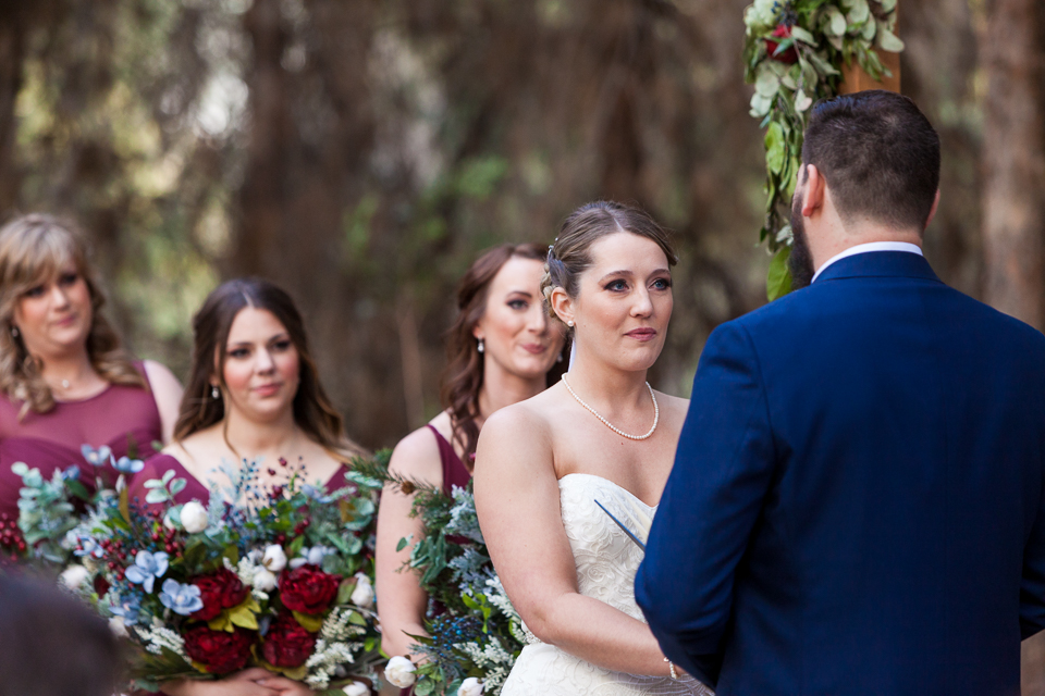 Bride getting teary eyed during her Schnepf Farms wedding ceremony. 