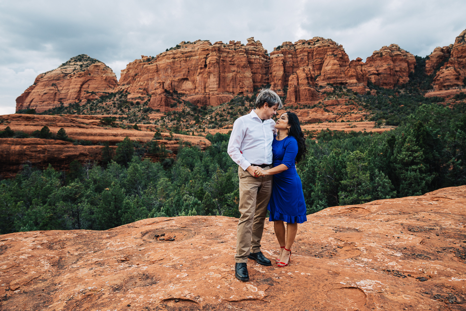 Couple holding hands on Hangover Trail in Sedona AZ.