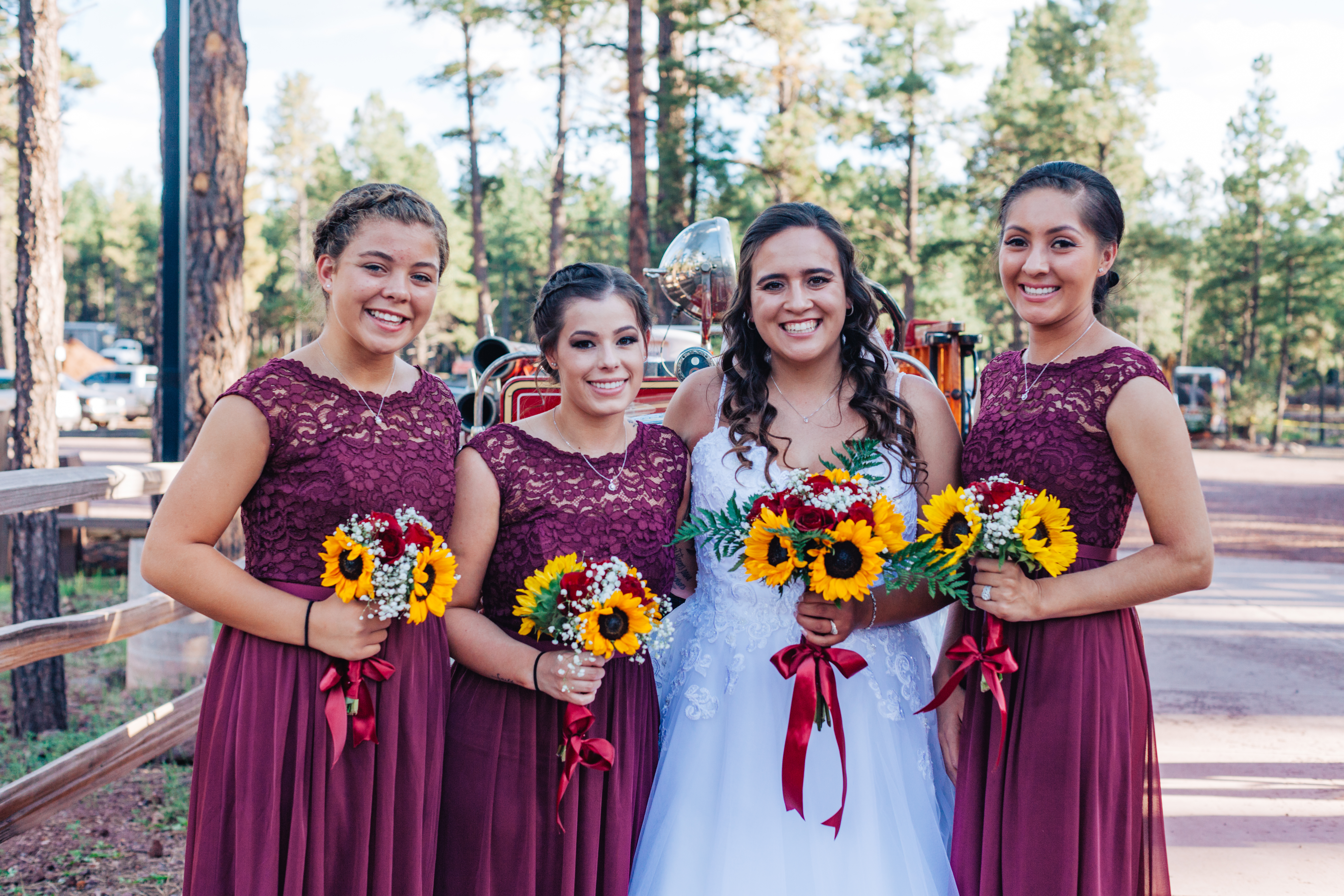 Bride posing with bridesmaids at Bearizona wedding. 