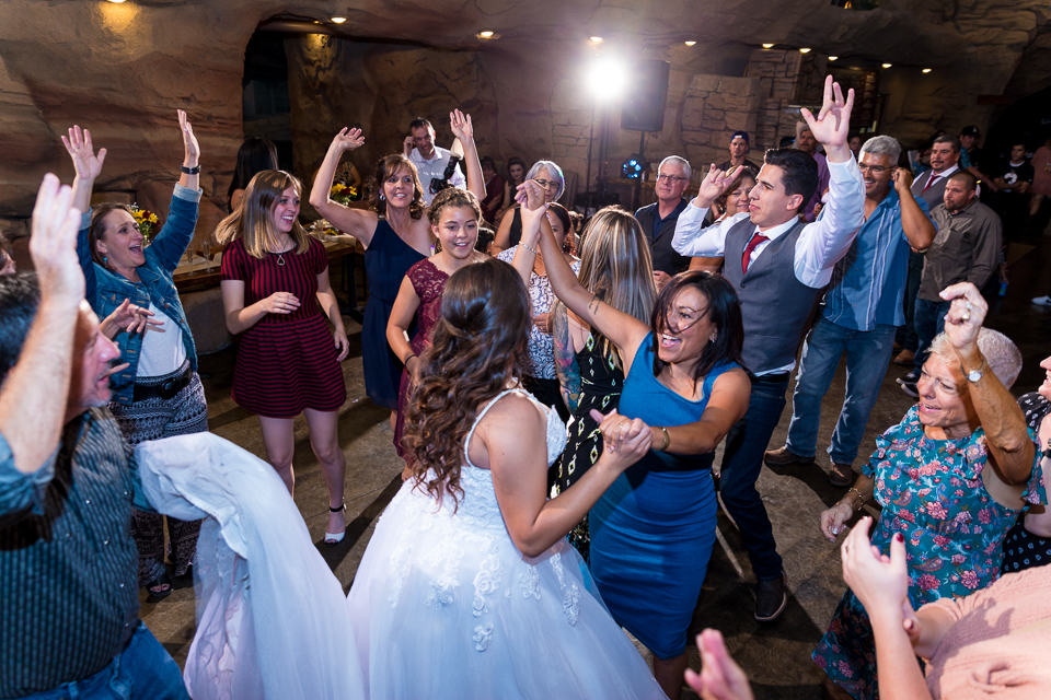 Bride dancing during wedding reception. 