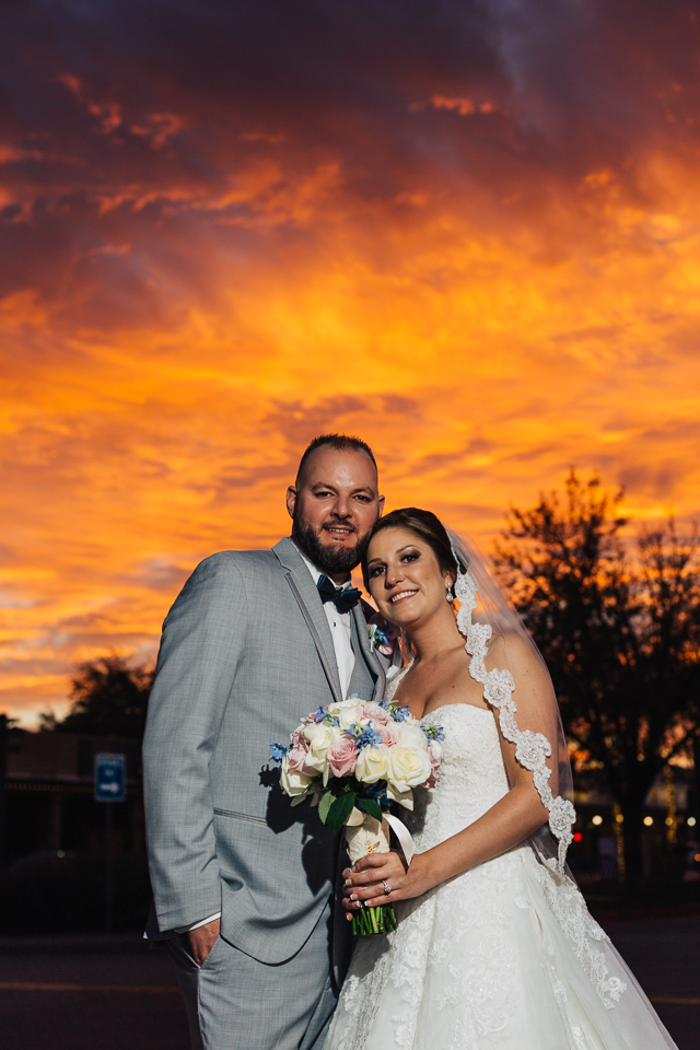 Bride and groom posing during an Arizona sunset. 