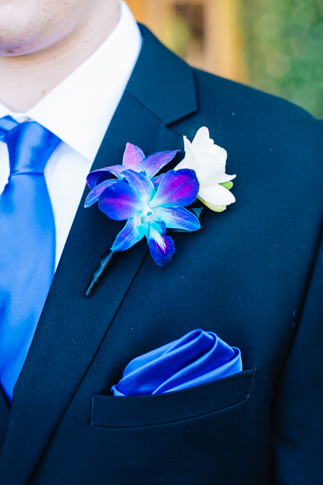 Close up of groom's boutonnière. 