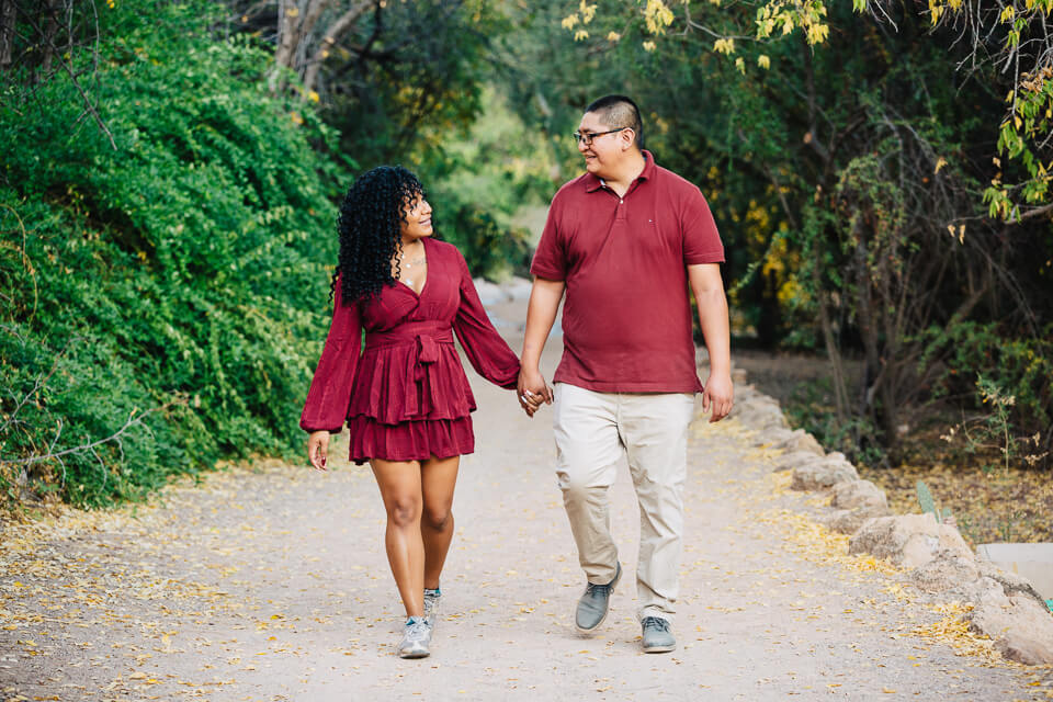 Couple walking down trail at the Boyce Thompson Arboretum for their engagement session.