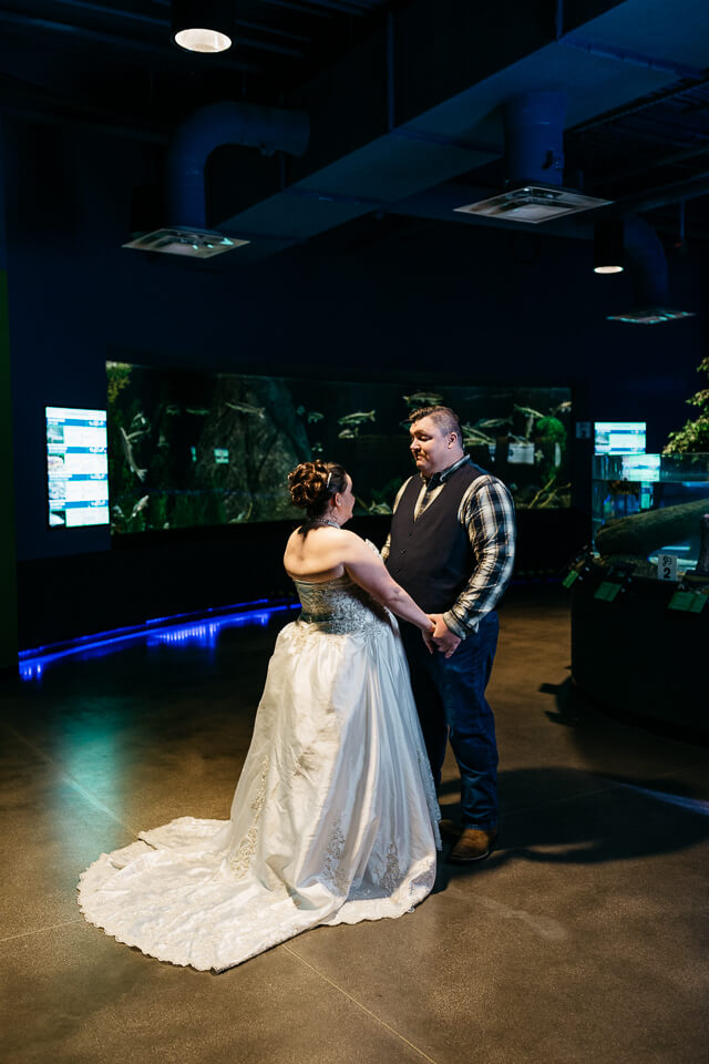 First look for bride and groom at OdySea Aquarium.