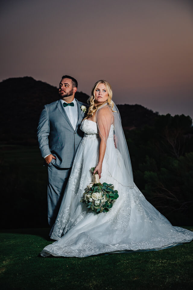 Sunset portrait of a bride and groom at Las Sendas Golf Club. 