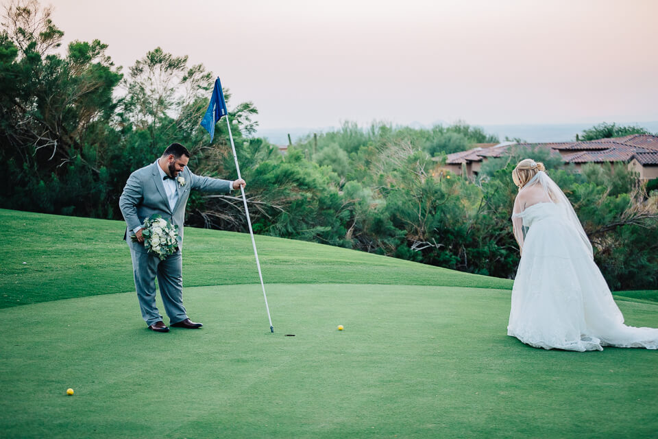 Bride putting a golf ball. 