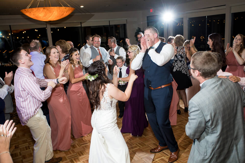 Bride and groom dancing during wedding reception.