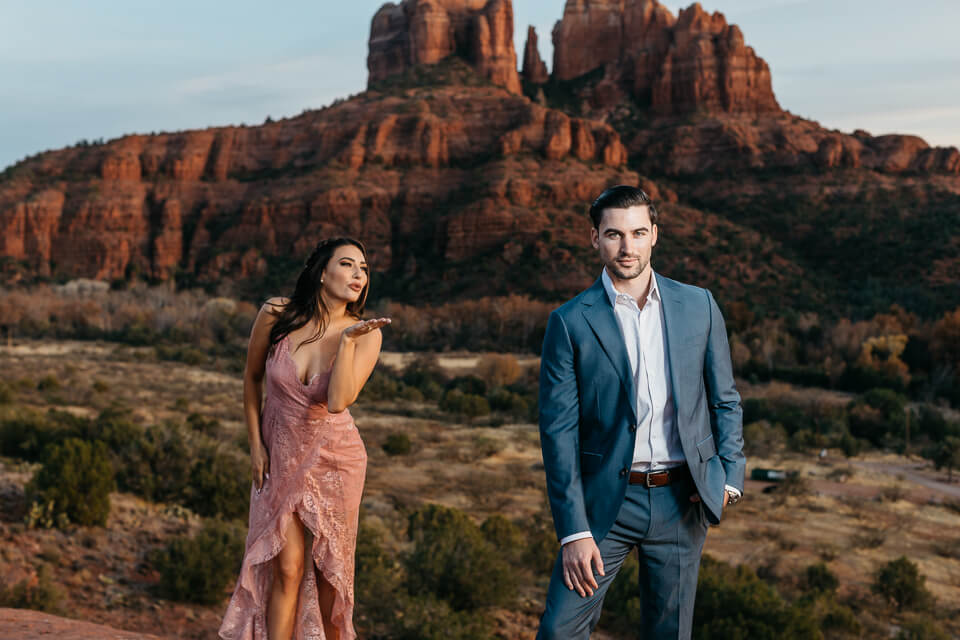 Girl blowing kiss to her fiancé during their Sedona Engagement photos. 
