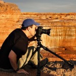 Chris looking through a camera a the Grand Canyon